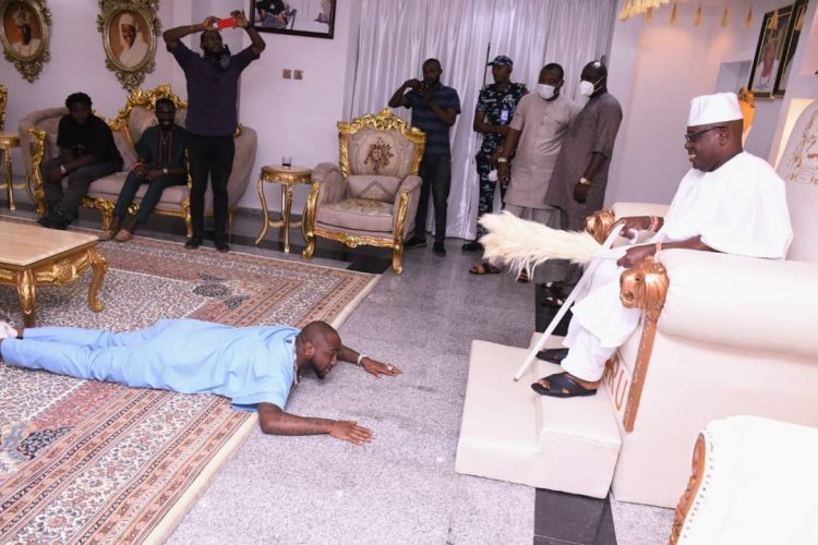 Davido Prostrates During Visit To Oniru