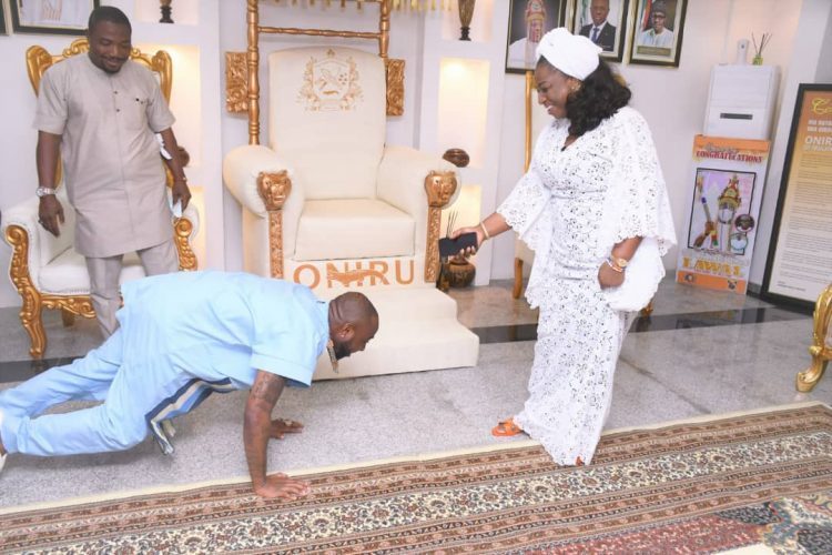 Davido Prostrates During Visit To Oniru