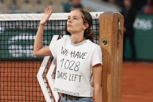 Play Halted During French Open Semi-final As Protester Tied Herself To The Net Before Being Escorted Away By Security