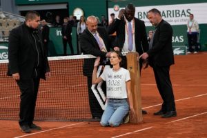 Play Halted During French Open Semi-final As Protester Tied Herself To The Net Before Being Escorted Away By Security