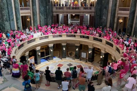 Dozens of protesters gather in the Wisconsin state Capitol rotunda in Madison, Wis. Wednesday, June 22, 2022, in hopes of convincing Republican lawmakers to repeal the state’s 173-year-old ban on abortions