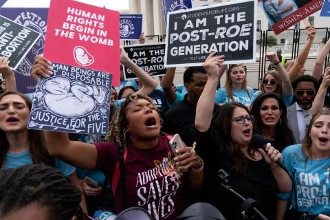 Anti-abortion protesters gather outside the Supreme Court in Washington DC on Friday