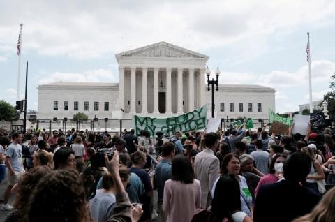 Demonstrators gathered even before the decision was released Friday morning