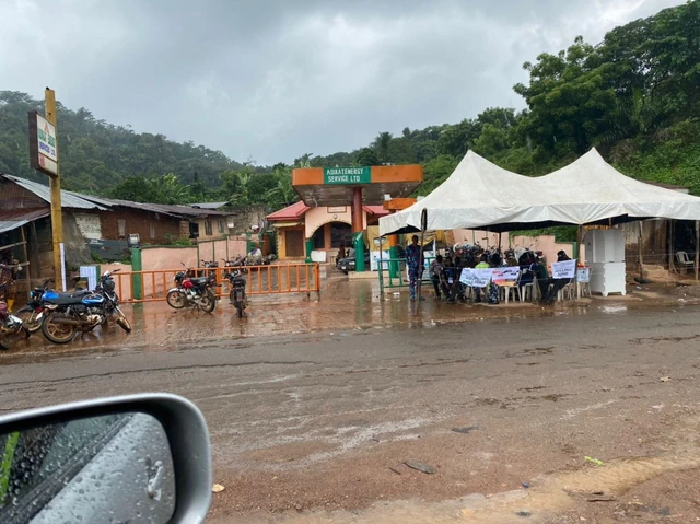 Voters run for cover as rain pours down during election in Osun