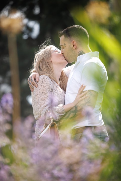 Tony Garnett kisses his new love Sofiia Karkadym as they pose for pictures in Bradford close to the registry office