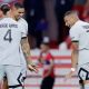 Kylian Mbappe, right, celebrates with PSG teammates in a runaway win over Lille in Ligue 1.