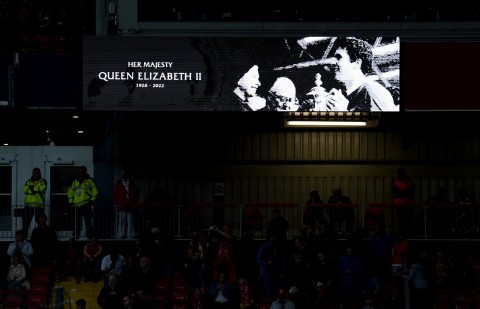 A tribute to Queen Elizabeth II can be seen on a big screen before the UEFA Champions League match at Anfield on Tuesday evening