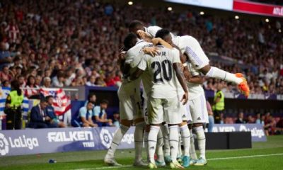 Real Madrid players celebrate after scoring a goal against Atletico in LaLiga.