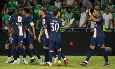 PSG players celebrate after Lionel Messi scored a goal against Lyon in Ligue 1.