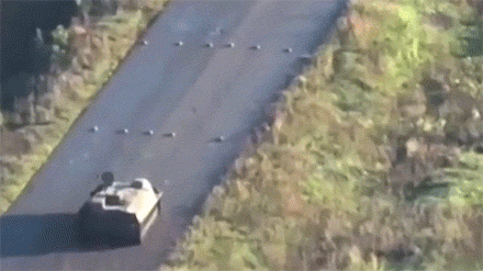 Russian soldier blindly drives tank over row of land mines